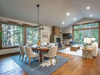 Experience luxurious mountain living in this stunning open-concept dining and living area.