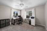 This home office features two distinct workstations, perfect for a shared workspace or dual home offices.
