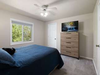 This bedroom offers a comfortable and inviting atmosphere, perfect for relaxation.