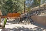 Escape to your private backyard oasis featuring a stunning multi-tiered waterfall and spa.