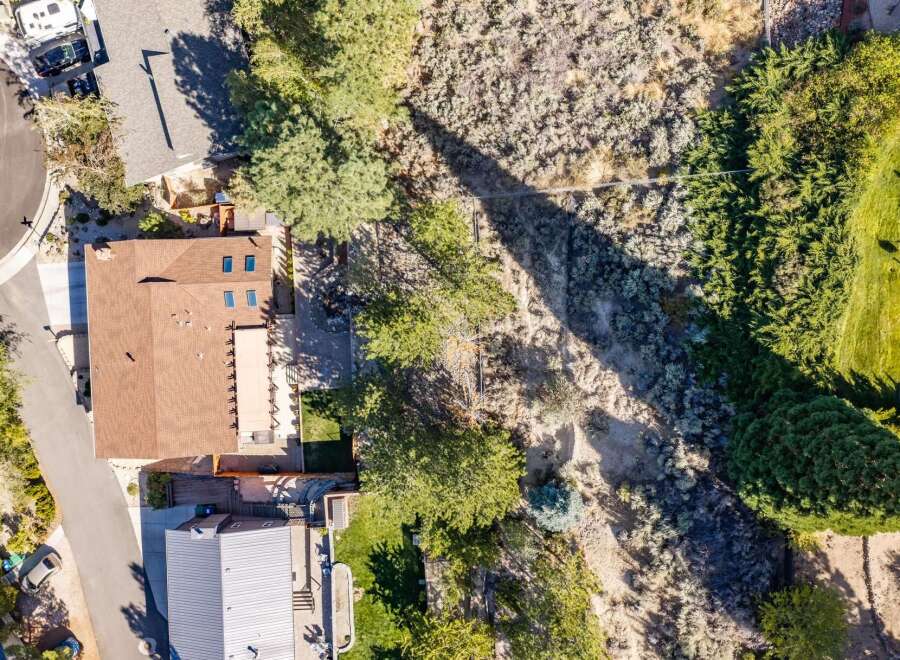 Discover this stunning aerial view showcasing a beautiful home with a spacious backyard, perfect for outdoor living and entertaining.