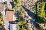 Discover this stunning aerial view showcasing a beautiful home with a spacious backyard, perfect for outdoor living and entertaining.