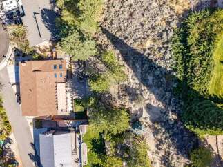 Discover this stunning aerial view showcasing a beautiful home with a spacious backyard, perfect for outdoor living and entertaining.