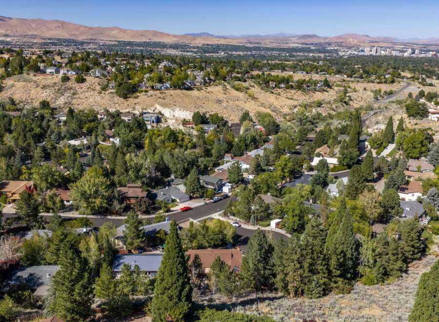 Discover this charming home nestled amidst mature trees, offering a serene and private setting.