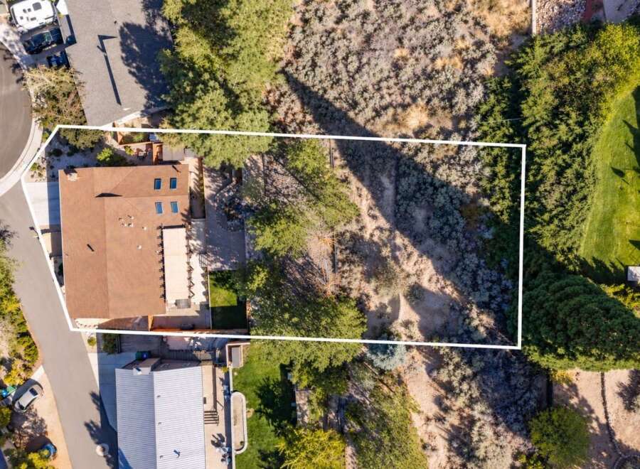 Discover this stunning aerial view showcasing a beautiful home with a spacious backyard, perfect for outdoor living and entertaining.