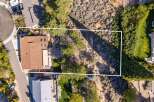Discover this stunning aerial view showcasing a beautiful home with a spacious backyard, perfect for outdoor living and entertaining.