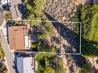 Discover this stunning aerial view showcasing a beautiful home with a spacious backyard, perfect for outdoor living and entertaining.