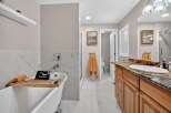 Indulge in luxury with this stunning bathroom featuring a freestanding bathtub perfect for a relaxing soak.