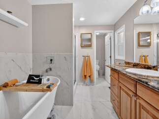 Indulge in luxury with this stunning bathroom featuring a freestanding bathtub perfect for a relaxing soak.