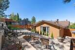 Enjoy outdoor living in this beautifully landscaped backyard featuring a spacious paver patio perfect for entertaining.