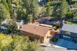 Discover this charming home nestled amongst mature trees, offering a serene and private setting.
