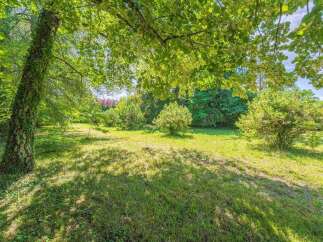 Discover a serene oasis with this stunning property, featuring a lush, green lawn perfect for outdoor activities and relaxation.
