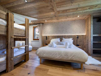 Experience rustic charm and modern comfort in this alpine-inspired bedroom.