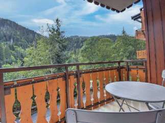 Enjoy breathtaking mountain views from this charming balcony, perfect for your morning coffee or evening relaxation.