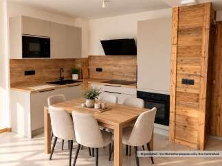 Experience modern living in this beautifully appointed kitchen and dining area, featuring sleek cabinetry and integrated appliances.