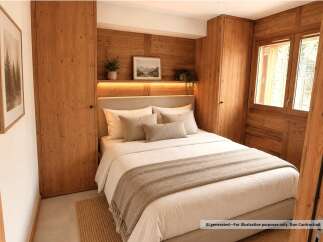 Experience cozy mountain living in this charming bedroom featuring warm wood paneling and integrated cabinetry.
