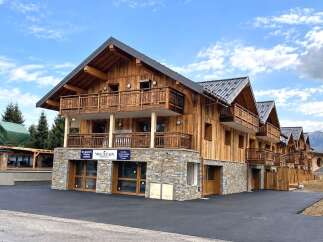 Discover this stunning wooden chalet-style property, perfect for a mountain getaway.