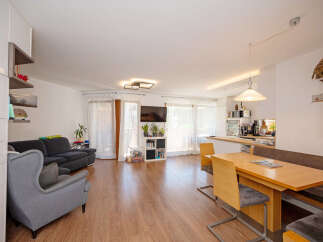Discover this inviting open-concept living and dining area, perfect for modern living.