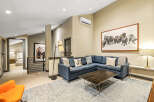 Experience modern mountain living in this spacious living area, featuring a comfortable sectional sofa perfect for gathering.