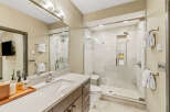 Experience modern luxury in this stunning bathroom featuring a spacious walk-in shower with elegant tile work and a built-in bench.