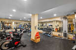 This well-equipped gym features a variety of cardio machines, including treadmills and stationary bikes, perfect for your daily workout.