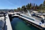 Experience lakeside luxury with this stunning property featuring a private dock and multiple boat slips, perfect for water enthusiasts.