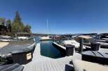 Experience lakeside living at its finest with this stunning marina view, featuring a collection of well-maintained boats docked and ready for adventure.