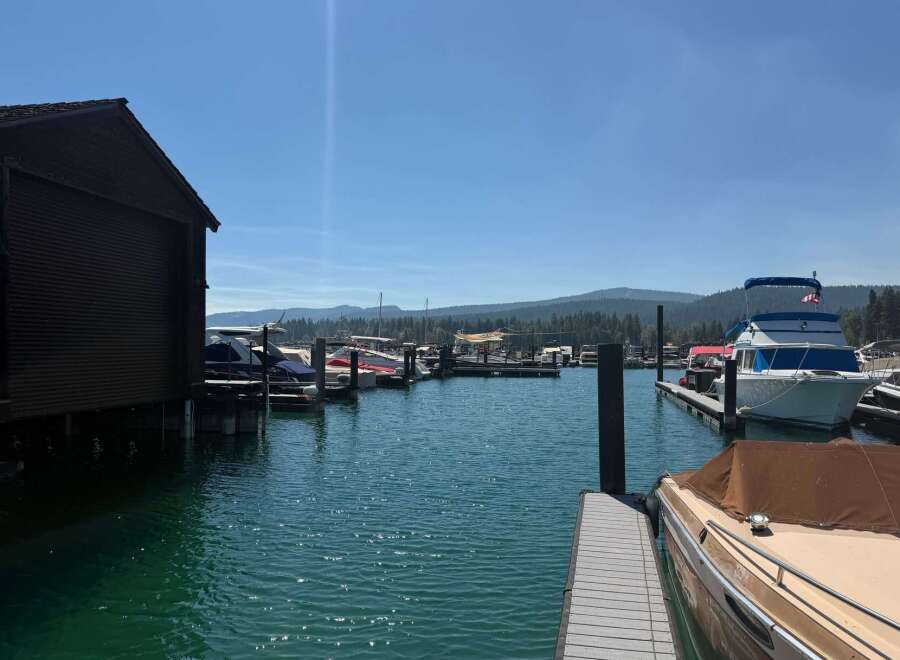 Discover waterfront living with this stunning marina view, featuring a private boathouse and ample dock space for your vessels.