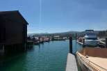 Discover waterfront living with this stunning marina view, featuring a private boathouse and ample dock space for your vessels.