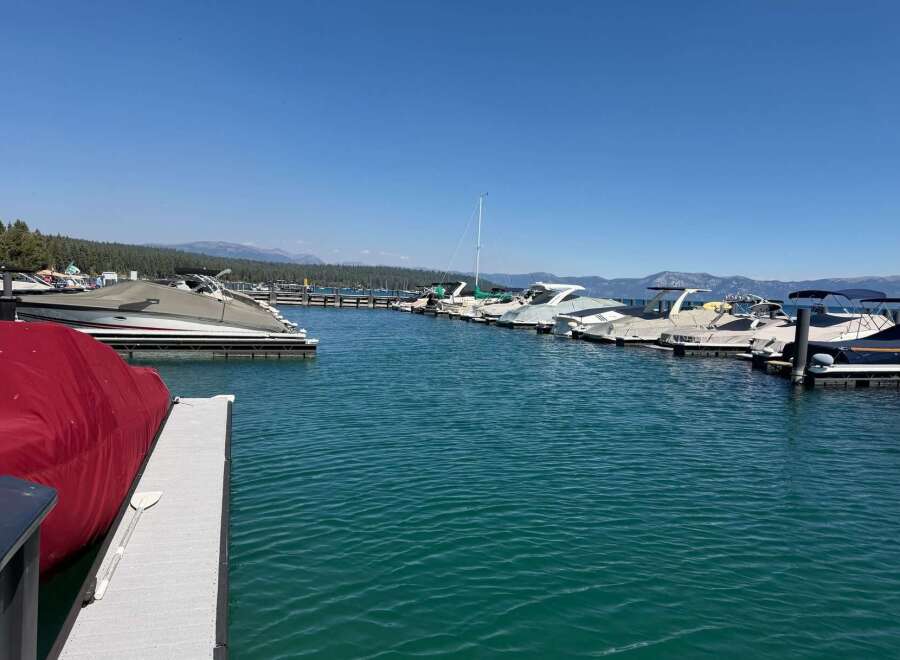 Experience the ultimate lakeside lifestyle with this stunning property featuring a private dock and multiple boat slips.