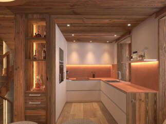 Experience rustic charm in this mountain retreat featuring a modern kitchen with warm ambient lighting and sleek cabinetry.