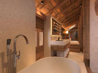 Experience rustic luxury in this stunning bathroom featuring a freestanding bathtub and a sleek modern faucet.