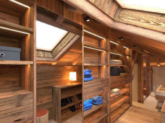 Experience rustic luxury in this charming attic dressing room, featuring warm, natural wood paneling and integrated LED lighting that highlights the ample shelving and storage.