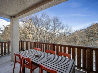 Enjoy breathtaking mountain views from this charming balcony, perfect for al fresco dining or morning coffee.