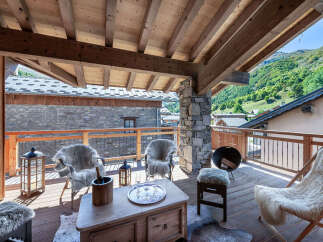 Experience breathtaking mountain views from this charming balcony, perfect for enjoying your morning coffee or evening wine.