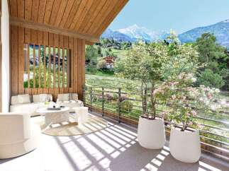 Experience breathtaking mountain views from this stunning alpine retreat's spacious balcony.