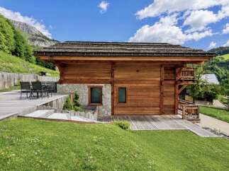 Experience luxury mountain living in this stunning wooden chalet, nestled amidst breathtaking alpine scenery.
