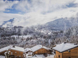 Experience the charm of alpine living in this picturesque mountain village, nestled amidst snow-covered forests and majestic peaks.