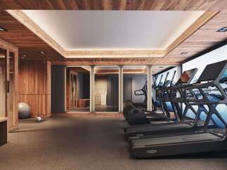 Experience ultimate wellness in this modern gym, featuring state-of-the-art treadmills and a serene mountain mural.