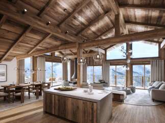 Experience luxury mountain living in this stunning chalet featuring a grand open-plan living space with a modern kitchen island and a spacious dining area.