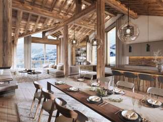 Experience luxury mountain living in this stunning chalet, featuring a grand dining area perfect for entertaining and a cozy living space with a modern fireplace.