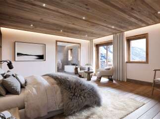 Experience ultimate luxury in this stunning mountain retreat bedroom, featuring a plush king-sized bed adorned with a sumptuous faux fur throw.