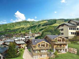 Experience luxury mountain living in this stunning chalet, boasting exquisite wooden and stone architecture.
