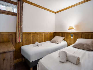 This charming room features two comfortable twin beds, perfect for accommodating guests or family.