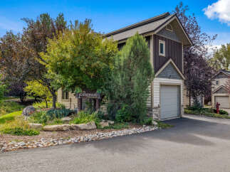 Discover this charming property nestled among mature trees, offering a serene and private setting.