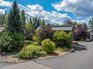 Discover this charming property nestled amongst mature trees and lush landscaping, offering a serene and private retreat.