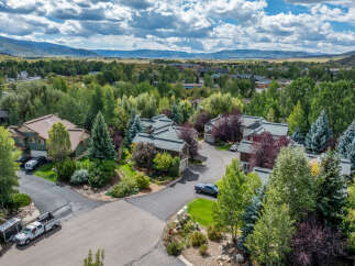Nestled amidst lush greenery and mature trees, this property offers a serene mountain retreat.
