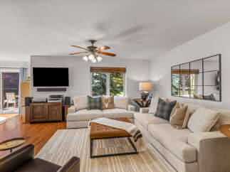Experience comfort and style in this inviting living room, featuring a spacious sectional sofa perfect for gatherings.