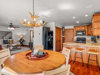 Experience rustic charm and modern convenience in this inviting dining and kitchen area.