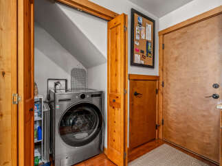 Discover the convenience of a dedicated laundry space featuring a modern LG WashCombo All-in-One unit.
